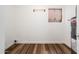 Utility room with tile floor, water heater, and exterior access at 6627 S 42Nd Pl, Phoenix, AZ 85042