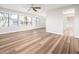 Spacious living room featuring new wood flooring and multiple windows at 6627 S 42Nd Pl, Phoenix, AZ 85042