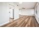 Open concept living room showcasing new floors and view into the kitchen at 6627 S 42Nd Pl, Phoenix, AZ 85042
