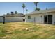 Backyard featuring a grass lawn and a volleyball net at 6907 E Palm Ln, Scottsdale, AZ 85257