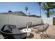 Charming backyard features a brick patio with comfortable seating, perfect for entertaining outdoors at 6907 E Palm Ln, Scottsdale, AZ 85257