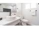 Bathroom featuring a vessel sink, modern fixtures, hexagon tiles and a bright white motif at 6907 E Palm Ln, Scottsdale, AZ 85257