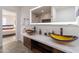 Bathroom features unique vessel sinks, a large lit mirror, and modern vanity at 6907 E Palm Ln, Scottsdale, AZ 85257