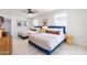 Spacious bedroom featuring two beds, ceiling fan, and neutral decor at 6907 E Palm Ln, Scottsdale, AZ 85257