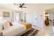 Inviting bedroom featuring a comfortable bed, a door leading to a patio, and access to an organized closet at 6907 E Palm Ln, Scottsdale, AZ 85257