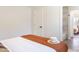 Bright bedroom features a hat on the bed and an attached bathroom at 6907 E Palm Ln, Scottsdale, AZ 85257
