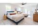 Bright bedroom with tile floor, ceiling fan, neutral decor, and access to the outdoors at 6907 E Palm Ln, Scottsdale, AZ 85257