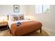 Cozy bedroom featuring patterned throw pillows, stylish lamps, and a neutral color scheme, creating a welcoming space at 6907 E Palm Ln, Scottsdale, AZ 85257