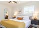 Bright bedroom featuring a ceiling fan, decorative rug, and modern furnishings, creating a cozy and stylish retreat at 6907 E Palm Ln, Scottsdale, AZ 85257