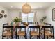 Inviting dining room featuring a large wooden table, modern lighting, and stylish decorative accents at 6907 E Palm Ln, Scottsdale, AZ 85257