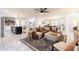 Open-concept living room featuring a comfortable leather sectional, stylish decor, and plenty of natural light at 6907 E Palm Ln, Scottsdale, AZ 85257