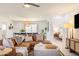 Comfortable living room with a leather sectional, modern decor, and ample natural light at 6907 E Palm Ln, Scottsdale, AZ 85257