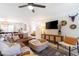 Bright living room boasts a comfortable leather sectional sofa and chic decor, perfect for relaxation at 6907 E Palm Ln, Scottsdale, AZ 85257