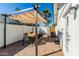 Back patio featuring a dining table, a canopy, and brick flooring at 6907 E Palm Ln, Scottsdale, AZ 85257