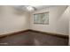 Bedroom with hardwood floors, a ceiling fan, and a window with blinds for natural light at 7126 N 19Th Ave # 228, Phoenix, AZ 85021
