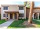 Charming townhouse featuring a cozy porch and well-maintained landscaping at 7126 N 19Th Ave # 228, Phoenix, AZ 85021