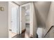 Hallway with hardwood floors and multiple doorways leading to other rooms and the upper and lower levels at 7126 N 19Th Ave # 228, Phoenix, AZ 85021