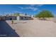 View of backyard featuring desert landscaping with gravel and beautiful shade tree at 719 W Pampa Ave, Mesa, AZ 85210