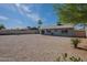 View of backyard and desert landscaping with ample room to design your ideal outdoor space at 719 W Pampa Ave, Mesa, AZ 85210
