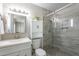 Updated bathroom with glass enclosed shower, modern fixtures and vanity at 719 W Pampa Ave, Mesa, AZ 85210