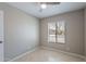 Bedroom with tile floor and neutral colored walls at 719 W Pampa Ave, Mesa, AZ 85210