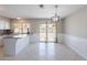Bright kitchen and dining area with modern lighting and a sliding door to the backyard at 719 W Pampa Ave, Mesa, AZ 85210