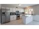 Well-lit kitchen boasting stainless steel appliances, granite countertops, and tiled backsplash at 719 W Pampa Ave, Mesa, AZ 85210