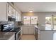 Updated kitchen featuring stainless steel appliances and granite countertops at 719 W Pampa Ave, Mesa, AZ 85210