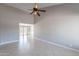 Spacious living room with tile flooring and high ceilings, offering an airy atmosphere at 719 W Pampa Ave, Mesa, AZ 85210