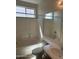 Bathroom featuring shower and tub combination and white vanity at 7327 W Donner Dr, Laveen, AZ 85339