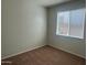 Bright bedroom with natural light and carpeted floors at 7327 W Donner Dr, Laveen, AZ 85339