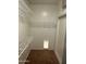 Walk-in closet featuring wire shelving and a built-in pet door at 7327 W Donner Dr, Laveen, AZ 85339