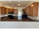 Well-lit kitchen featuring granite countertops, stainless steel appliances, and wood cabinetry at 7327 W Donner Dr, Laveen, AZ 85339