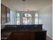 Stylish kitchen area with granite counters, a pendant light fixture, and arched windows at 7327 W Donner Dr, Laveen, AZ 85339