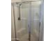 Bathroom features a tiled shower with glass door and built-in seat at 7327 W Donner Dr, Laveen, AZ 85339
