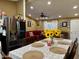 Dining area next to kitchen offers a view of the living room with ample lighting and stainless steel refrigerator at 8218 S 7Th St # Ofc, Phoenix, AZ 85042