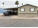 Inviting mobile home with covered parking, desert landscaping and a paved drive way in a well maintained community at 8218 S 7Th St # Ofc, Phoenix, AZ 85042
