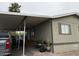 Charming tan home with covered parking and a ramp leading to the front door for easy accessibility at 8218 S 7Th St # Ofc, Phoenix, AZ 85042
