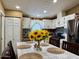 Eat-in kitchen featuring white cabinets, a black backsplash and stainless steel appliances at 8218 S 7Th St # Ofc, Phoenix, AZ 85042