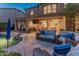 Outdoor living at its finest, with a pool, patio seating, and a view of the home's architecture at 8447 W Tether Trl, Peoria, AZ 85383