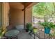Cozy covered patio with comfortable seating, perfect for enjoying the outdoor scenery at 8447 W Tether Trl, Peoria, AZ 85383