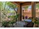 Cozy covered patio with comfortable seating, perfect for enjoying the outdoor scenery at 8447 W Tether Trl, Peoria, AZ 85383