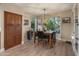 Dining area with natural light, stylish light fixture, and convenient access to pantry at 8447 W Tether Trl, Peoria, AZ 85383