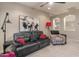 Comfortable living room with leather sofa, patterned chair, and decorative lighting at 8447 W Tether Trl, Peoria, AZ 85383