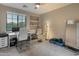 Bright home office features a large window, desk, chair, and workout equipment at 8447 W Tether Trl, Peoria, AZ 85383