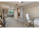 Home office with mirrored closet doors reflects a bright and spacious workspace at 8447 W Tether Trl, Peoria, AZ 85383