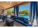 Comfortable outdoor patio featuring cushioned seating and view of the pool at 8447 W Tether Trl, Peoria, AZ 85383