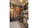Walk-in pantry with shelving, stocked with cans and household supplies, and decorated with a mural of a vintage building at 8447 W Tether Trl, Peoria, AZ 85383