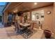 Covered patio featuring an outdoor dining area and a view into the home at 8447 W Tether Trl, Peoria, AZ 85383