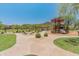 Community playground with slides, a gazebo, and walking paths at 8447 W Tether Trl, Peoria, AZ 85383